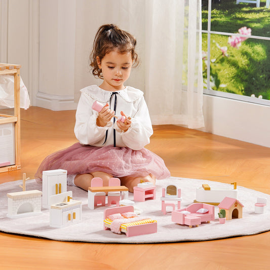 Girl in pink tutu skirt arranging ROBUD Wooden Dollhouse Furniture Set Pink miniature pieces on a white play rug in a sunny room