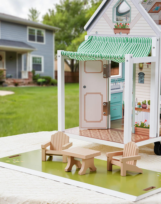 Wooden camper van dollhouse with a striped awning, balcony and outdoor chairs on its green base