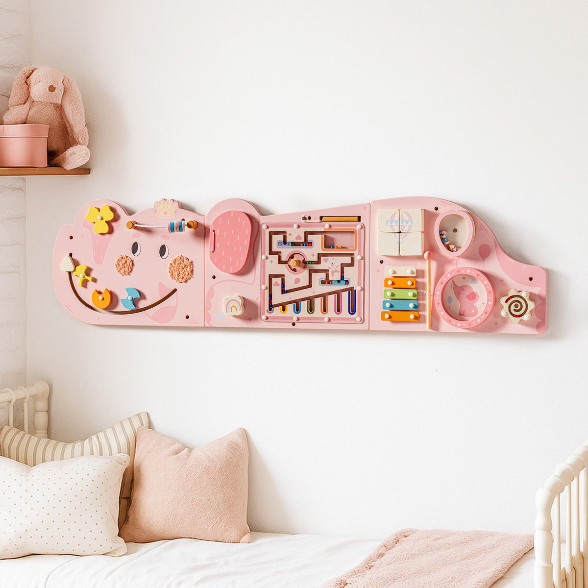 Pink elephant activity busy board, front view showing bead maze, gears, and abacus