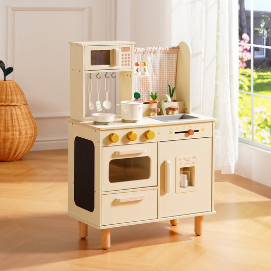 Cream wooden play kitchen with oven, microwave, and pot rail, displayed in a bright sunlit playroom.
