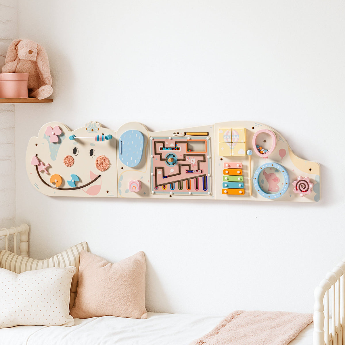 Cream wooden elephant-shaped activity busy board, front view showing bead maze, gears, and abacus