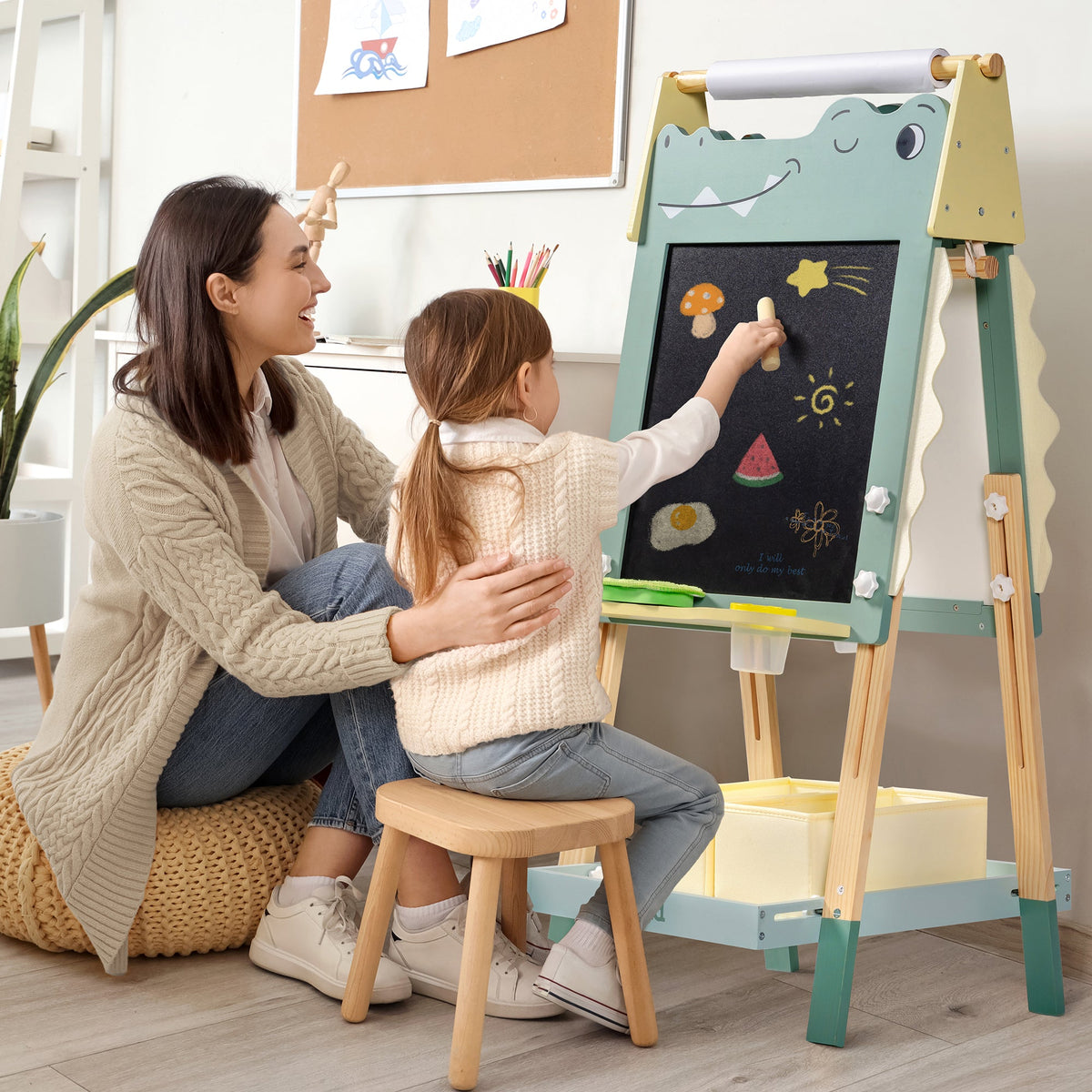 Mother and daughter drawing together on ROBUD Crocodile Easel with blackboard in a cozy living room setting
