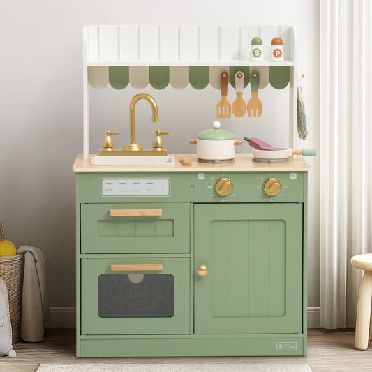 Sage green wooden play kitchen with white awning and gold faucet, front view in a home playroom