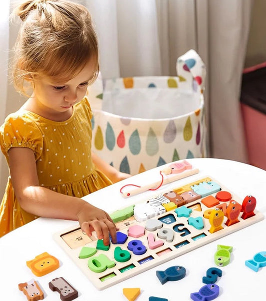 Child using the Shape and Number Busy Board at a home table, cropped to the photo