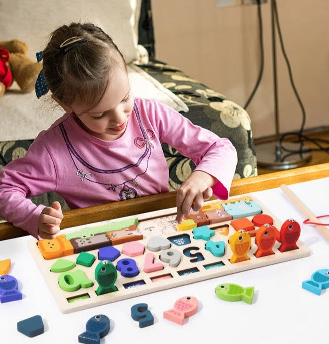Child using the Shape and Number Busy Board in a different home room, cropped to the photo